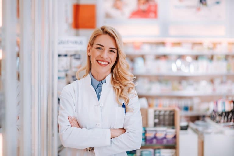 portrait-smiling-healthcare-worker-modern-pharmacy